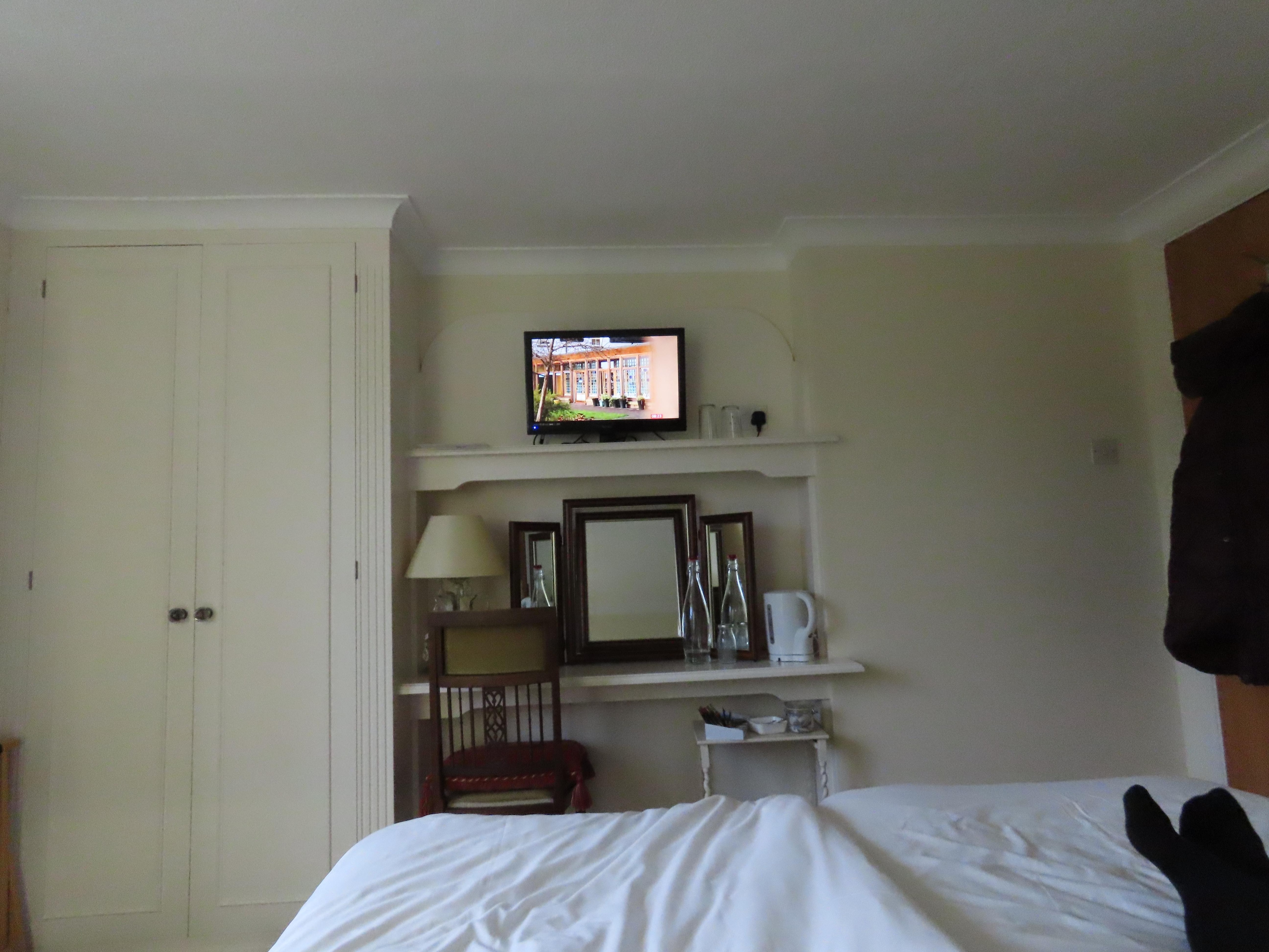 Bedroom with TV and storage