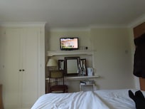 Bedroom with TV and storage