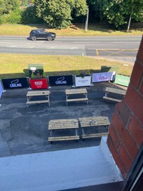Tables directly below window where people sat drinking lousy until well after 2am