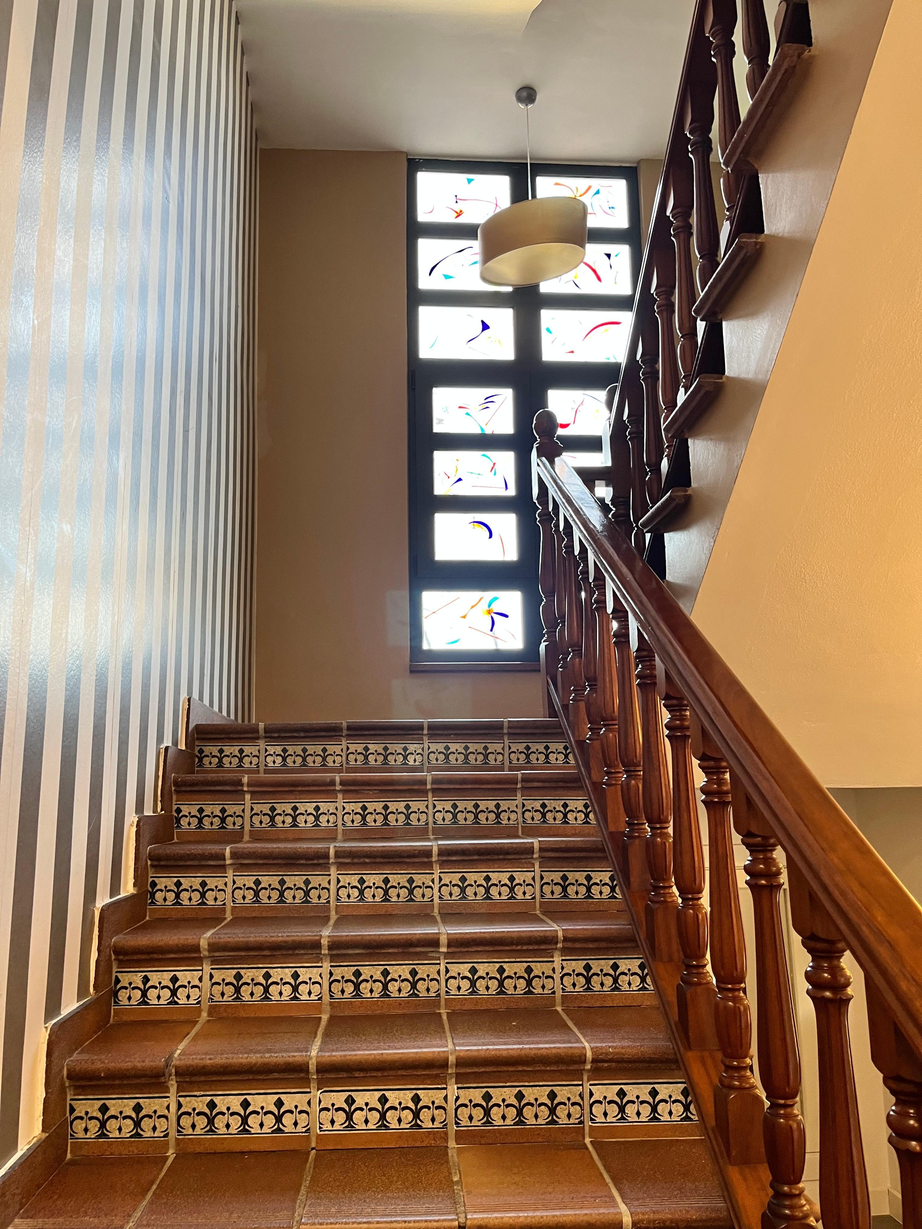 Stairs and decorative window 