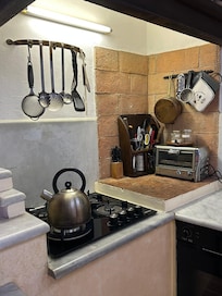 The kitchen was large enough to cook for a family, even though we only use the kitchen for coffee tea because we would take a walk in the morning and in the evening to get either cappuccino or dessert