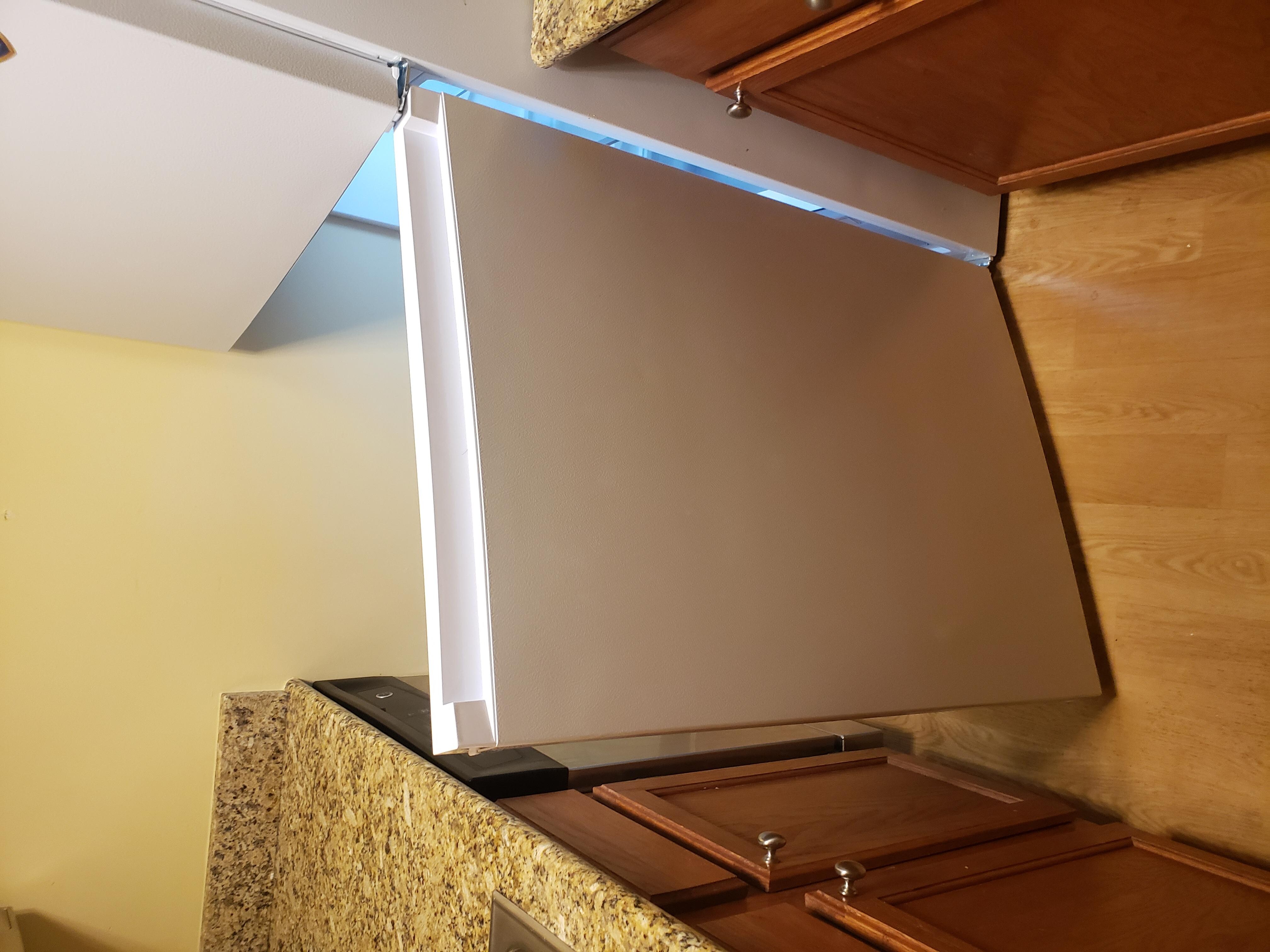Refrigerator opens wrong direction 