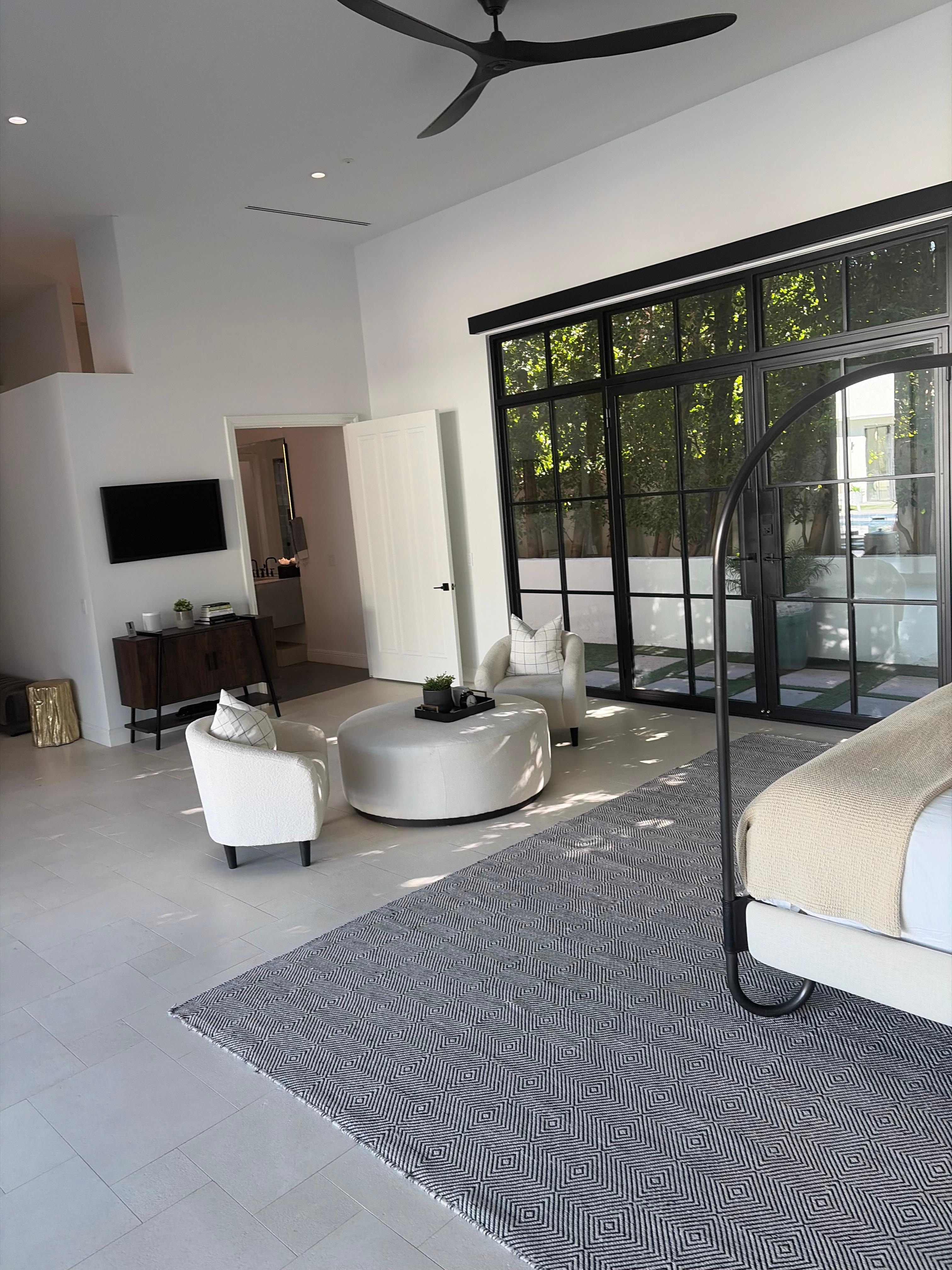 Master bedroom. Bathroom has a rainfall shower. And this room has direct access to a downstairs steam room and sauna 