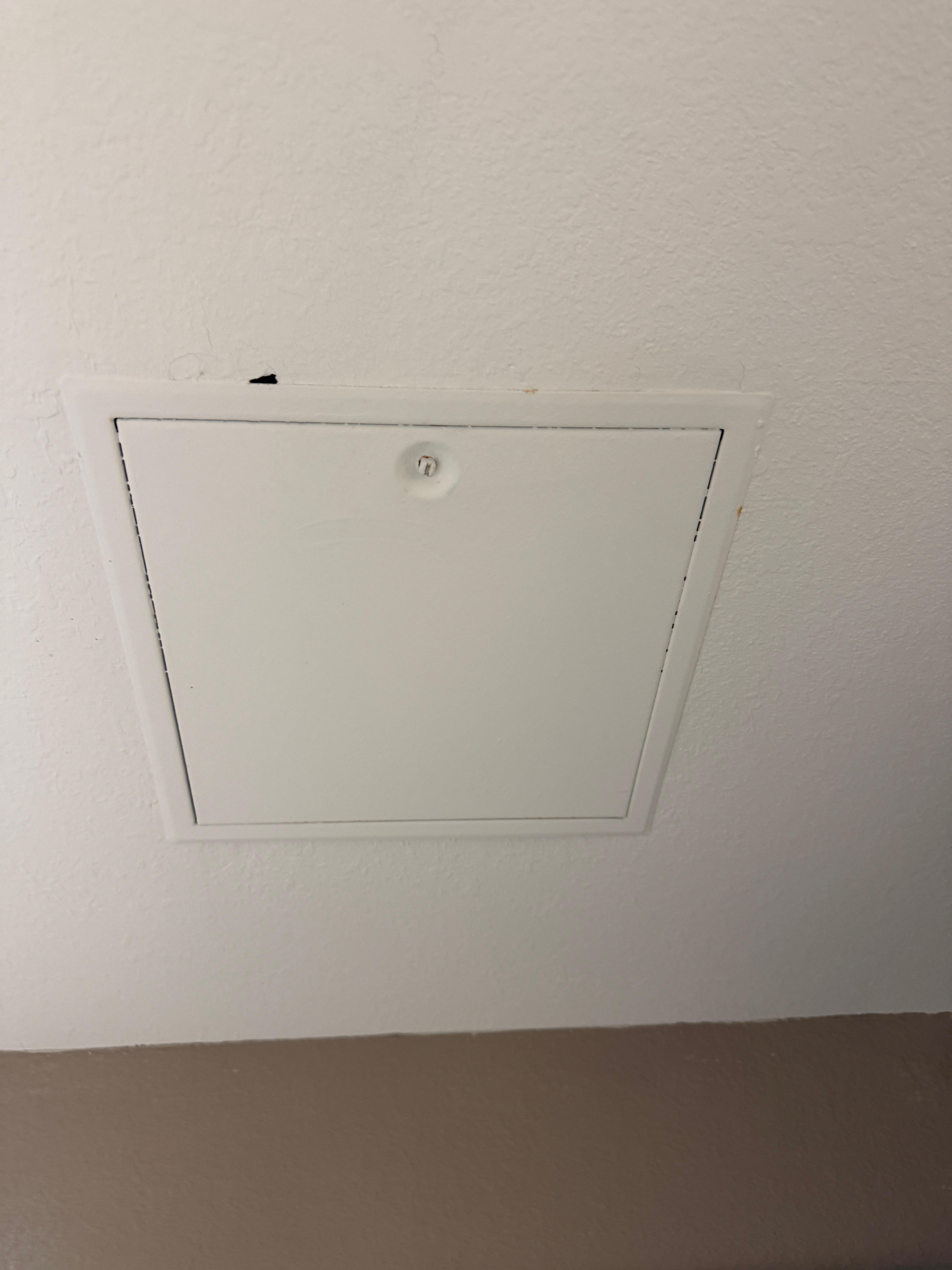 Defect hole beside the bathroom fan