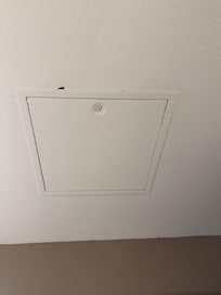 Defect hole beside the bathroom fan