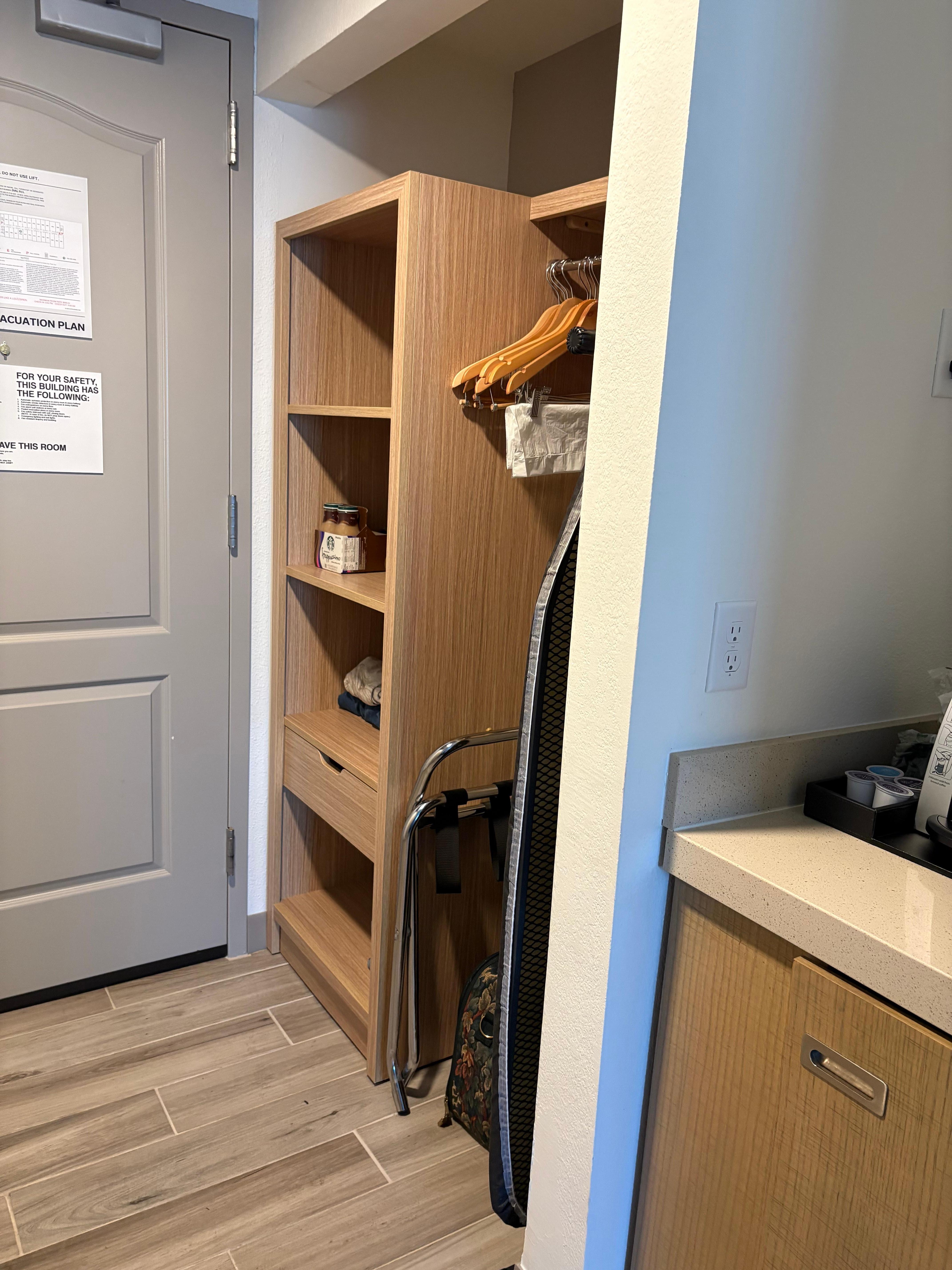 Closet with shelves, drawer, comes with hangers, ironing board and iron 