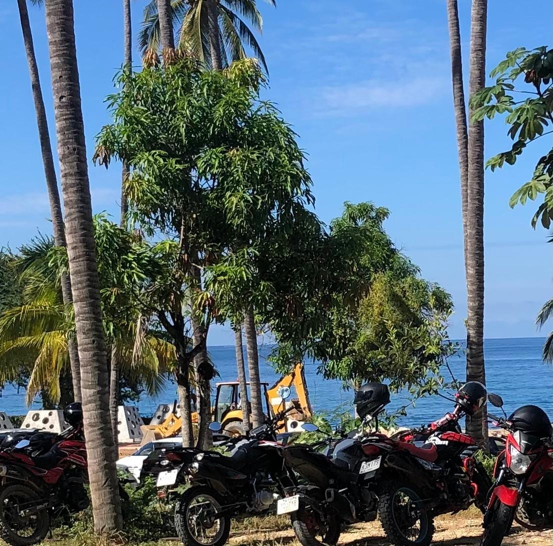 Back hoe and staff parking while construction continues where we were promised we could go and enjoy the ocean. 
