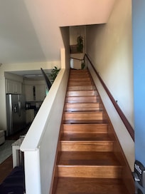 Stairs to the two bedrooms and one bathroom
