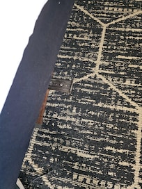 Medal frame sticking out of bedframe, painful if ran into it. Stuck clothes on it to cushion it. Mattress was unsteady, couldn't move it.