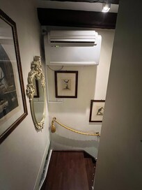 One air conditioner unit. Air had to take a 90 degree turn to reach primary bedroom.
