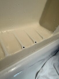Holes in shower surround