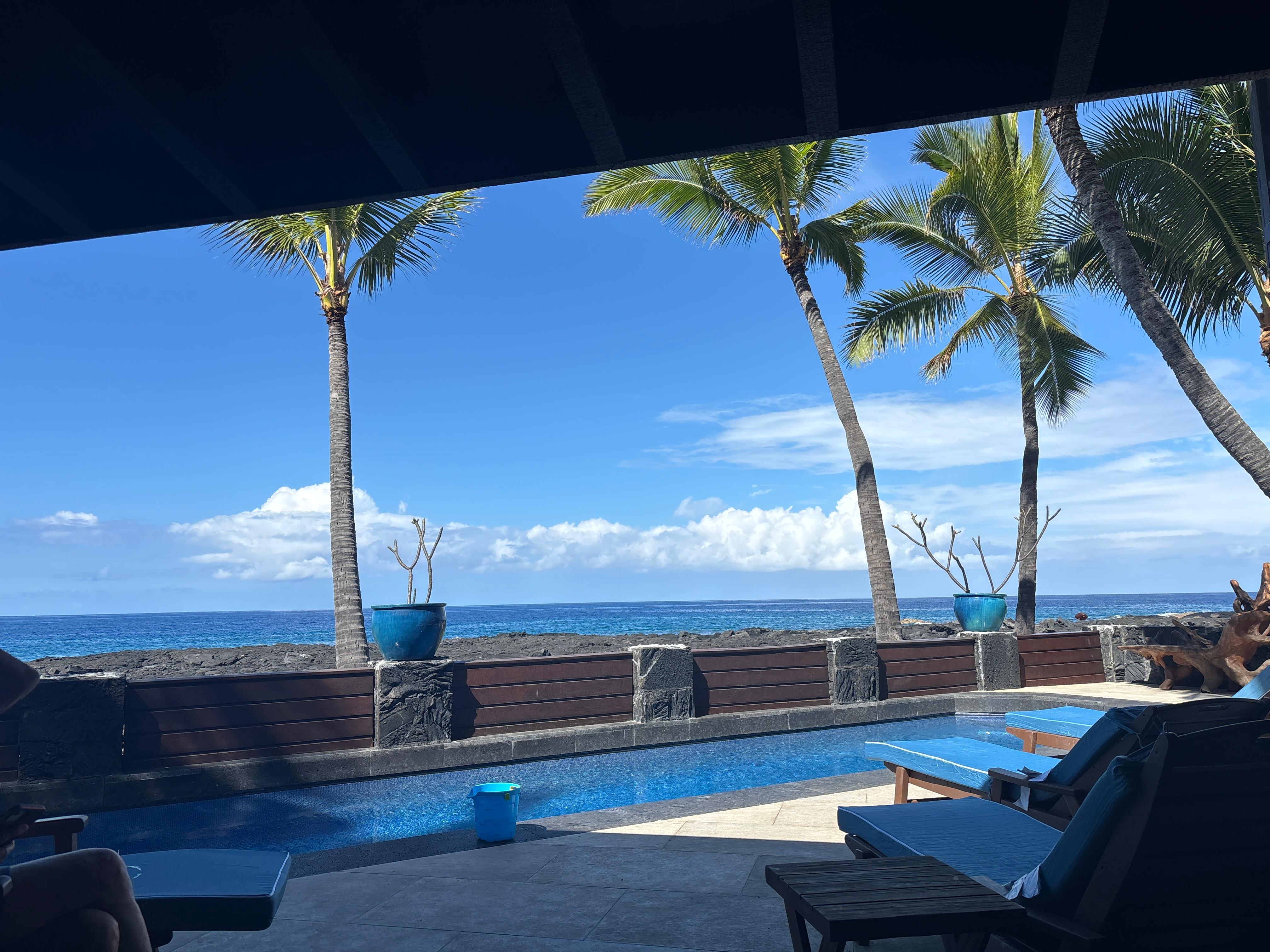 Looking out to the pool and beach from the living room area. 