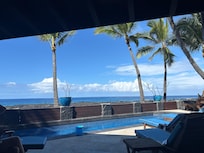 Looking out to the pool and beach from the living room area.