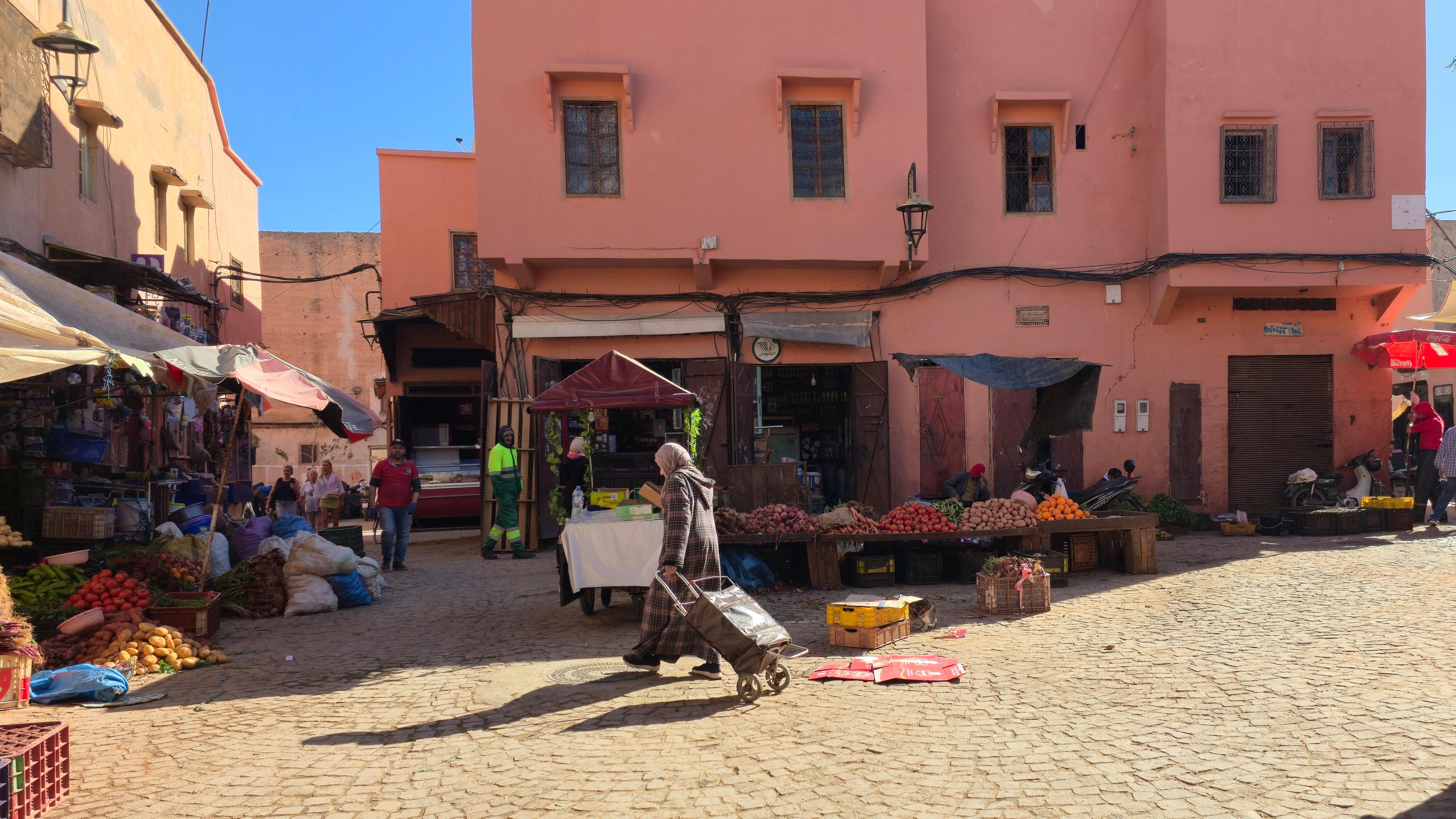 Here you take the road to the left, and shortly thereafter pass through an opening in an old wall that has "Riad Dar Massai" signage above it.