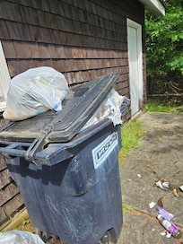 Overflowing Garbage left by previous guests