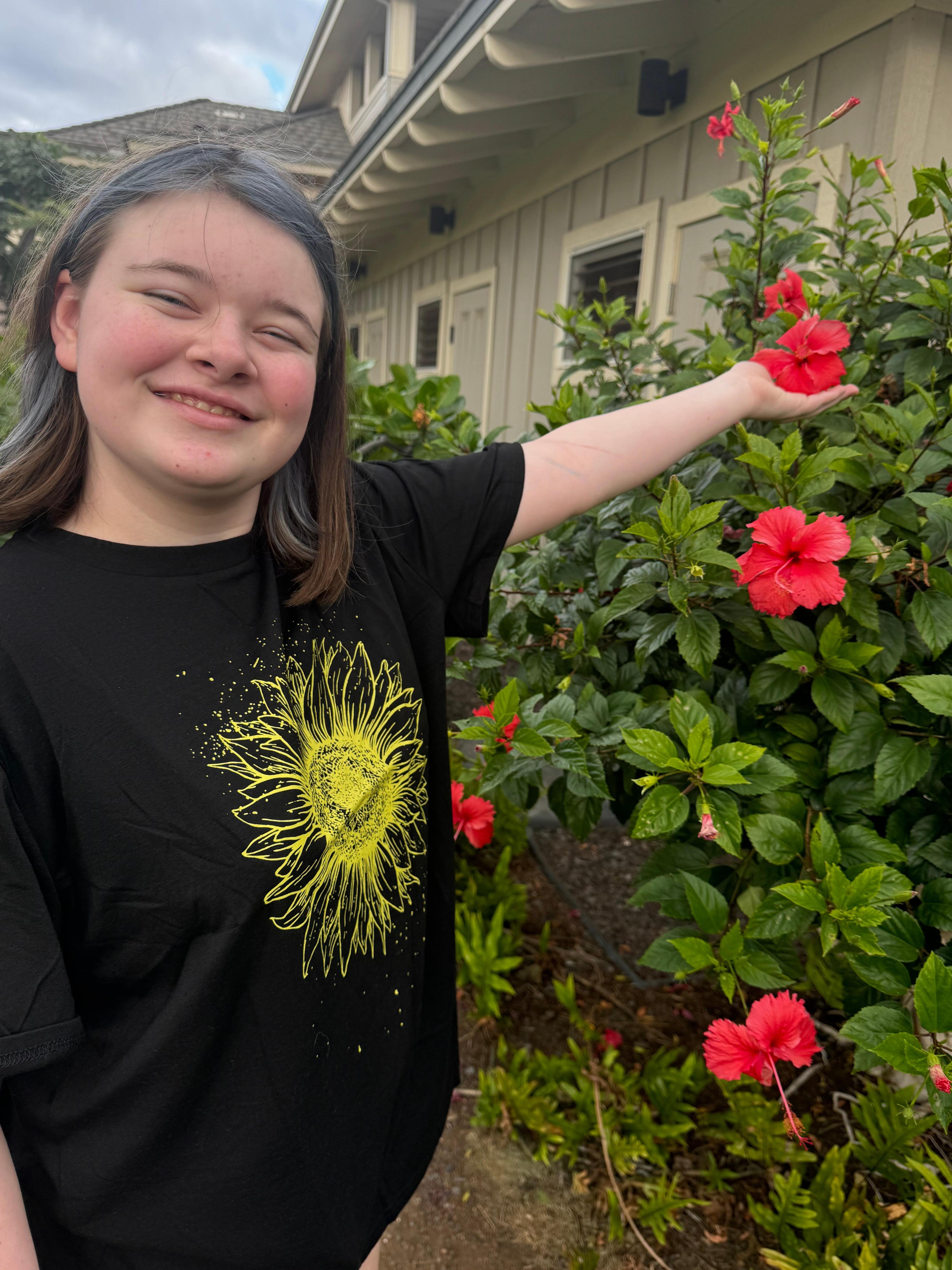 Our youngest love flowers around F1 condo in Waikoloa village