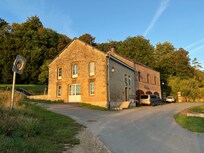 It really is a lovely spot. We parked in front of the garages there and the front door is at the top of those steps. Door lock is a little tricky. Hold the handle up while you turn the key.