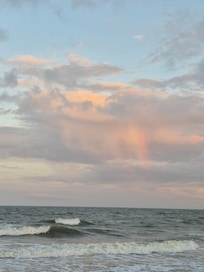 Rainbow at sunset on the beach