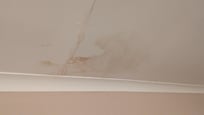 Damp stain on room ceiling