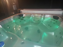 Black pieces of the jacuzzi pillows constantly in the water