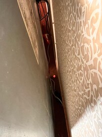 Uppon arrival, trash behind the dresser.