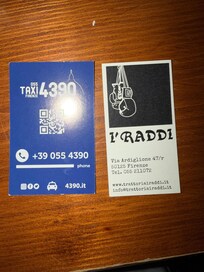 Taxi phone and the restaurant next door