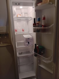 Fridge with basic supplies and filtered water.
