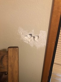 One of the holes in the walls.