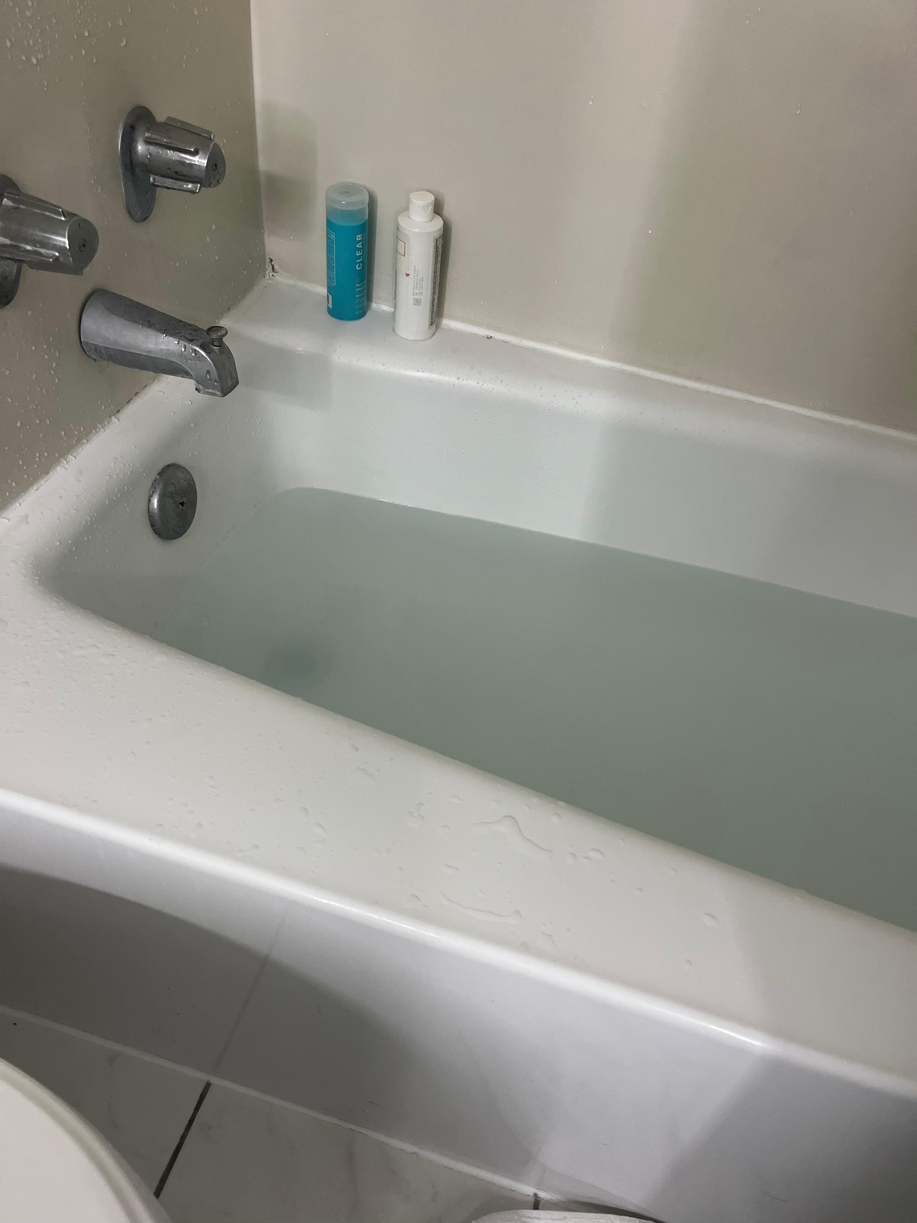 Bathtub 1 hr after use, before I plunged it myself for 30min to get the water down a little