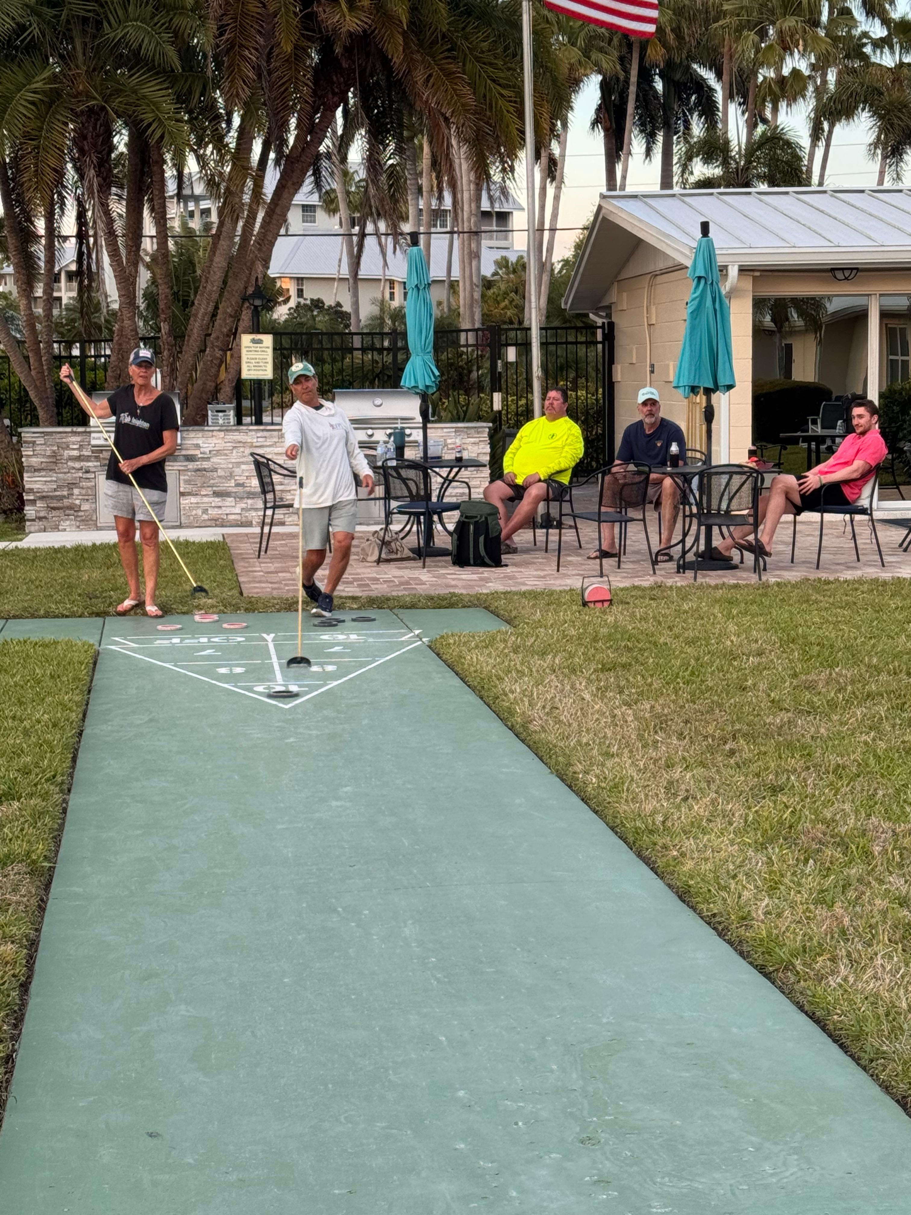 Shuffleboard outsie the door-fun