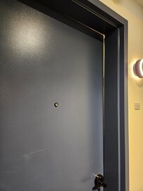 Gap at top of door into hotel room 321 from hallway
