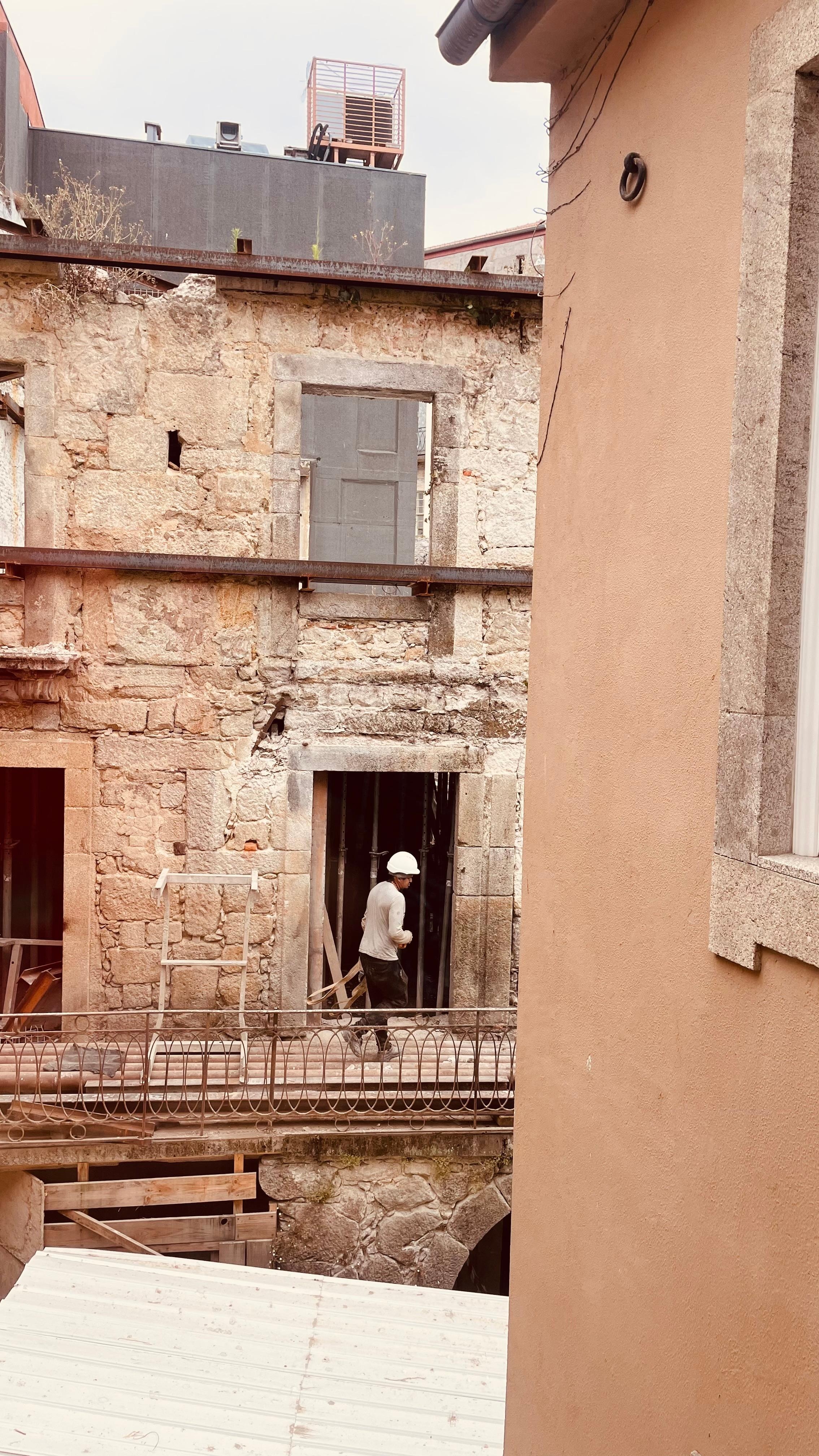Guys working on old bld out our window