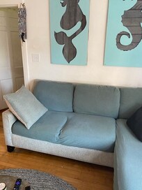 Worn sofa, fabric covered and not like in photo