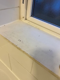 Grubby window sill