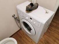 Narrowest washing machine I have ever seen but fully programmable.My shoe is to demonstrate.