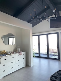 Amenities in main bedroom which include hot water kettle, mini frig, coffee, tea and cookies.