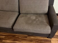 Stained sofa in secondary room