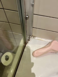 Mould all around bath. Waste plug not attached to the wall