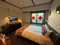 Charming! Love the sliding stained glass windows.