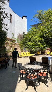 A warm terrace where you feel safe and private from the busy streets outside the hotel.