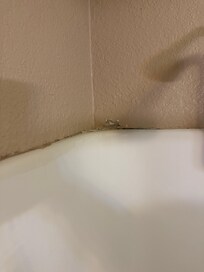 Cracked wall above shower