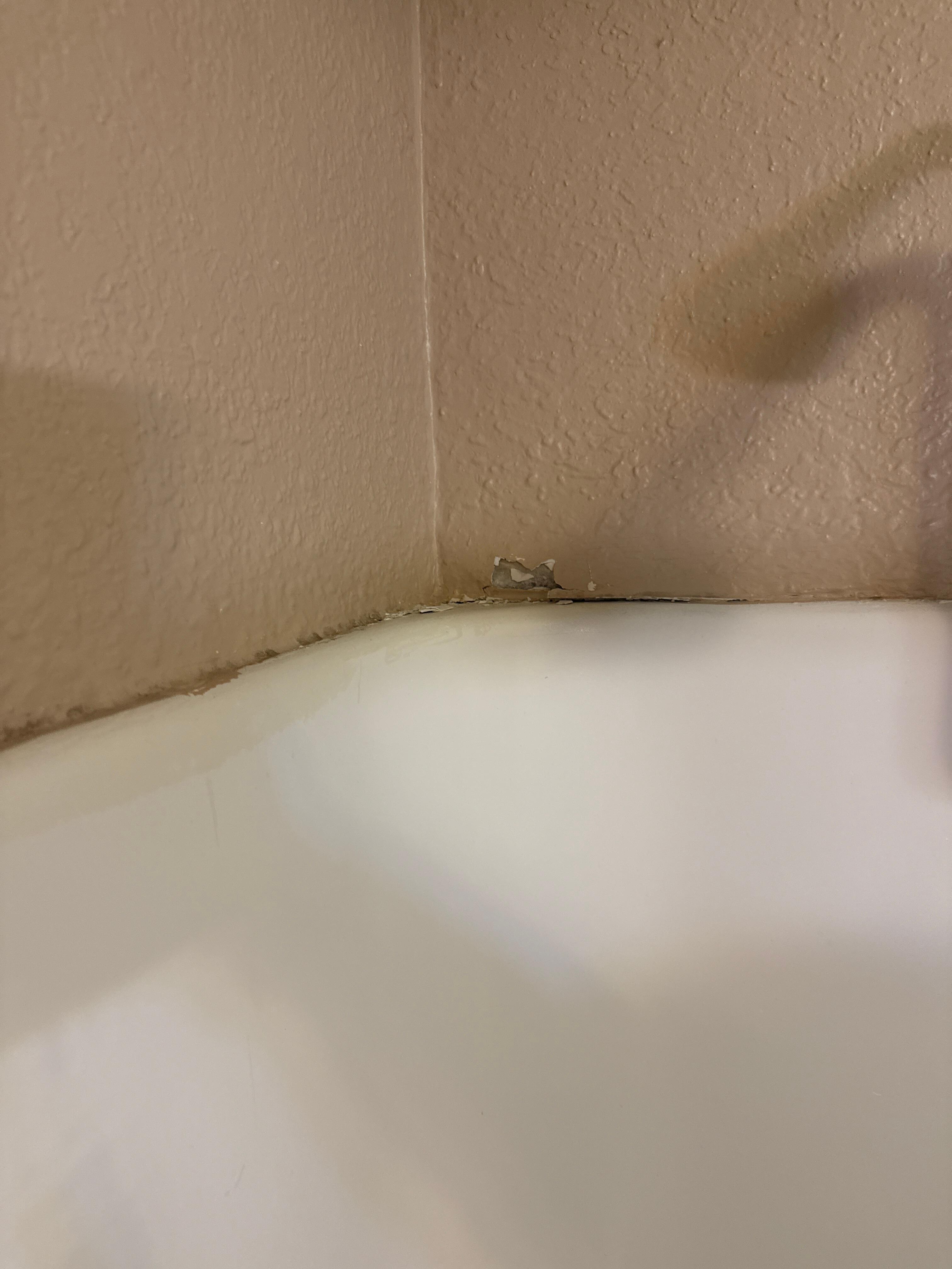 Cracked wall above shower 