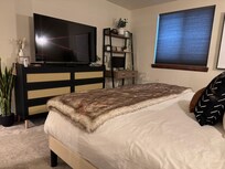 Master Bedroom with desk area that has monitor, printer & office supplies!