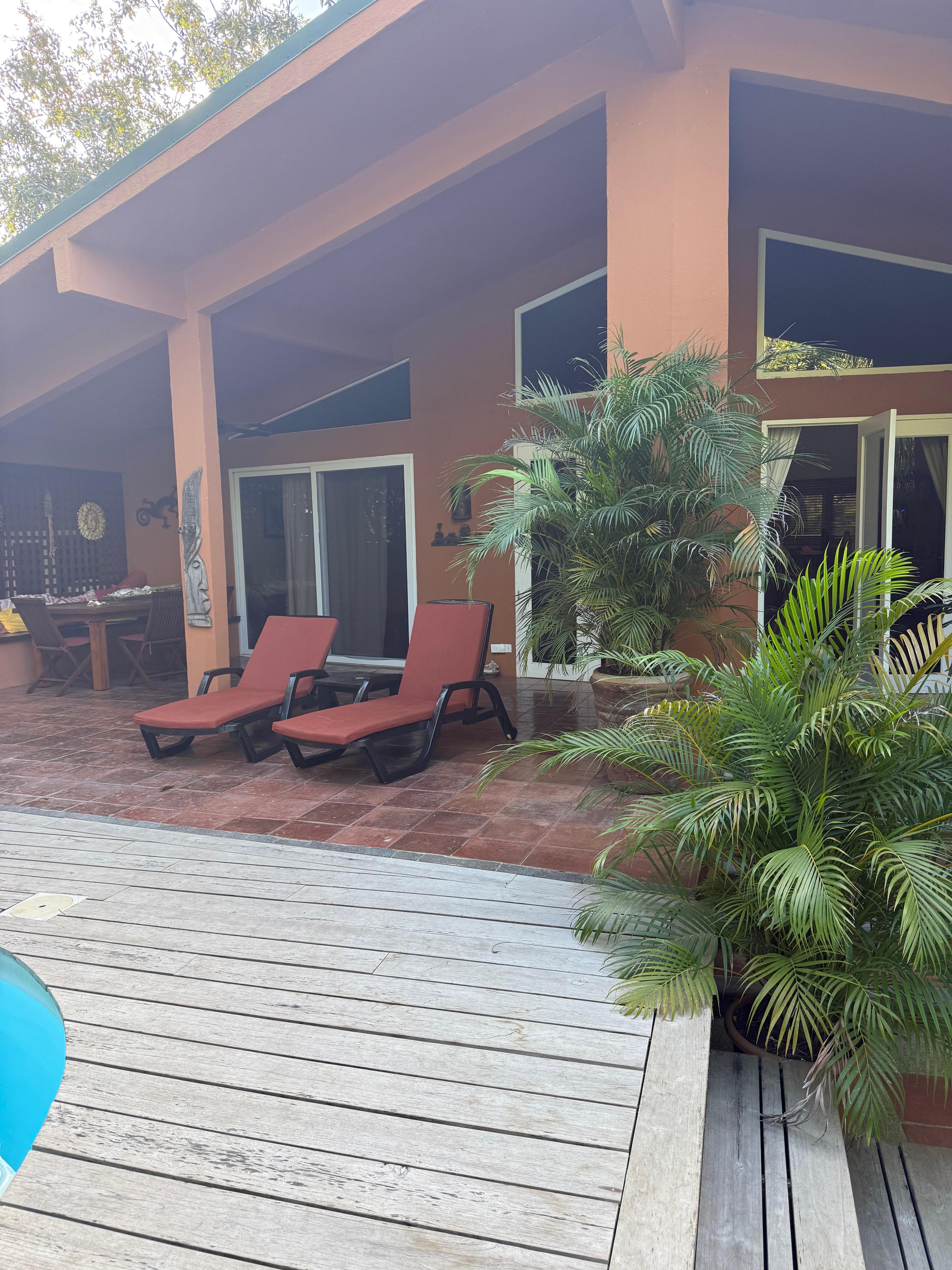 Private patio surrounded by beautiful plants and landscape