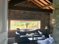 The rustic front room, all exposed beams and stone walls. Perfect for family games