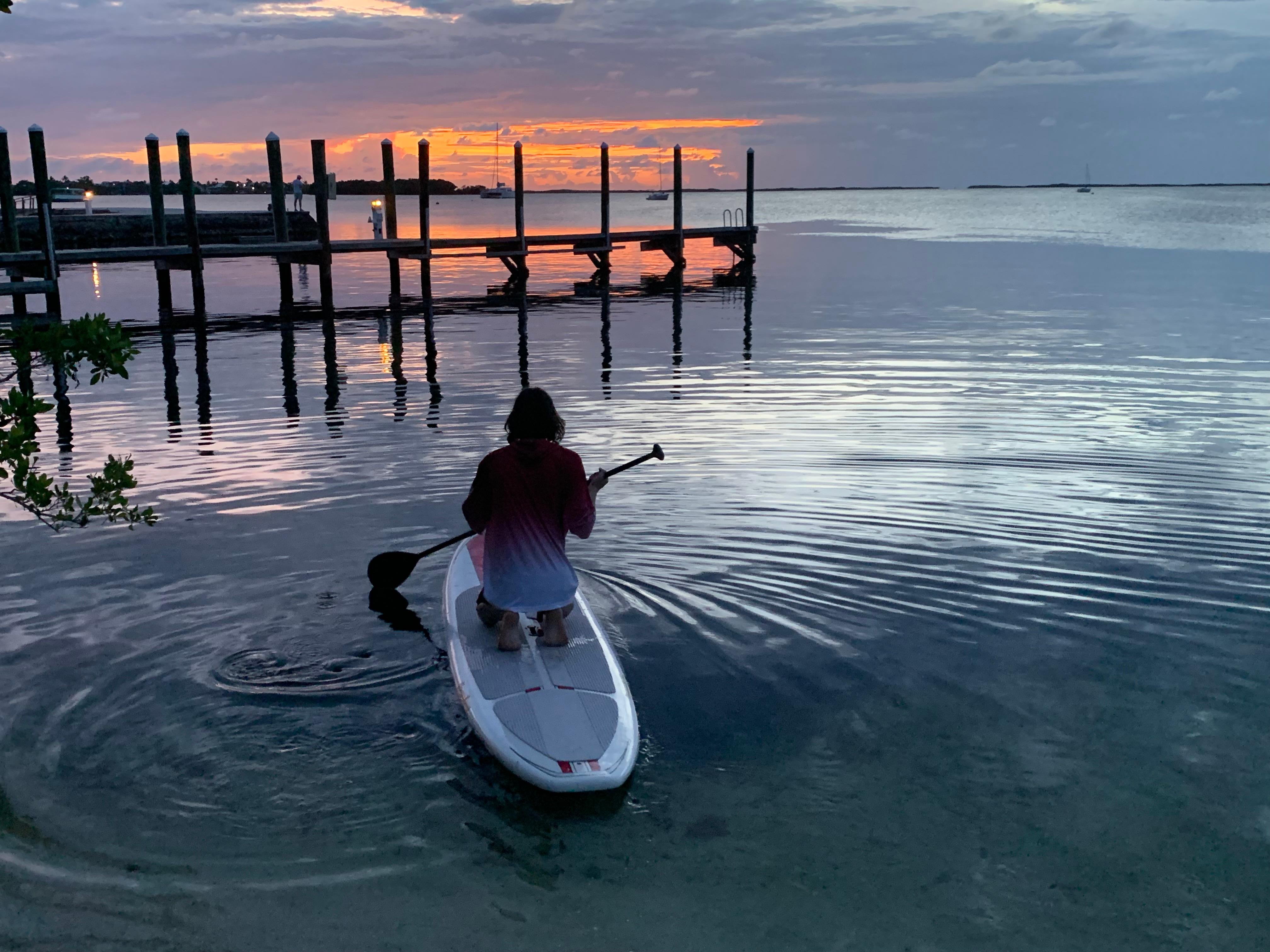 The sunset while on a paddle board 