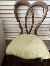 One of the many broken chairs in the house. This was in a bedroom. In addition there was a broken barstool and a broken dining room chair.