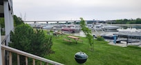 The yard has chaise lounge chairs, picnic tables...