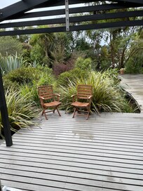 A peep into the lush green garden area with superb terraced decking walkway