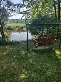 Relaxing and watching people float down the river.